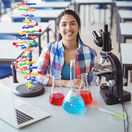 Science student with experiment