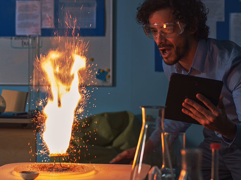 Physics teacher conducting experiment with fire