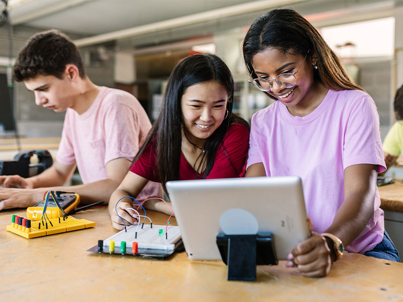 Two young students working on project