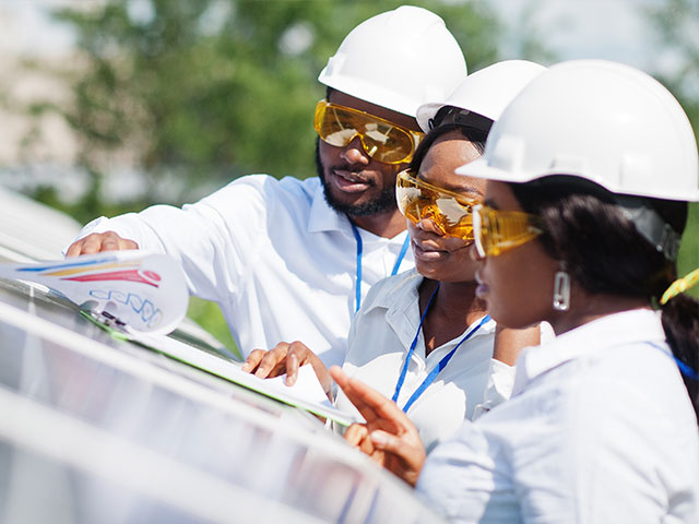 Engineers working on solar panels